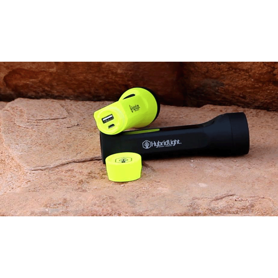 Journey 200 Solar Flashlight yellow and black on rock