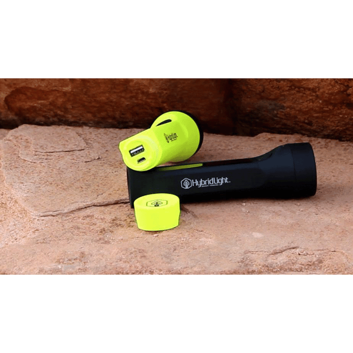Journey 200 Solar Flashlight yellow and black on rock