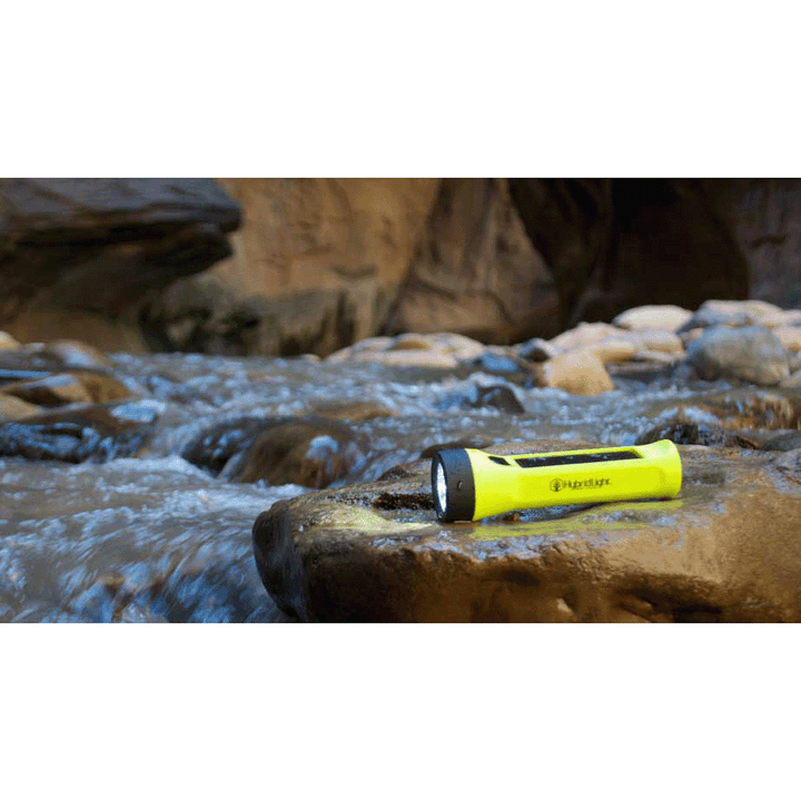 Journey 200 Solar Flashlight yellow on rock in river